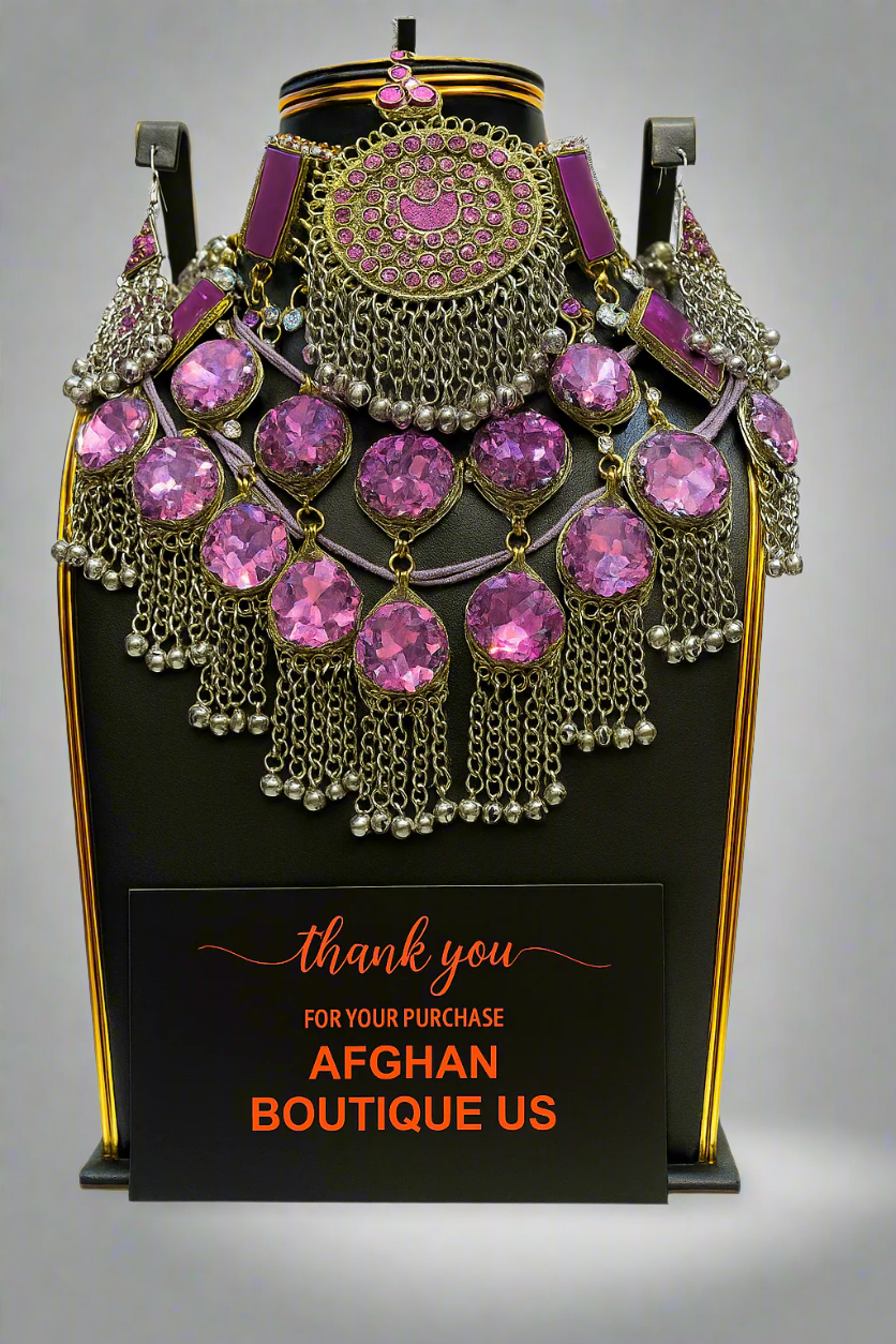 Traditional Afghan bridal jewelry set in silver and pink.