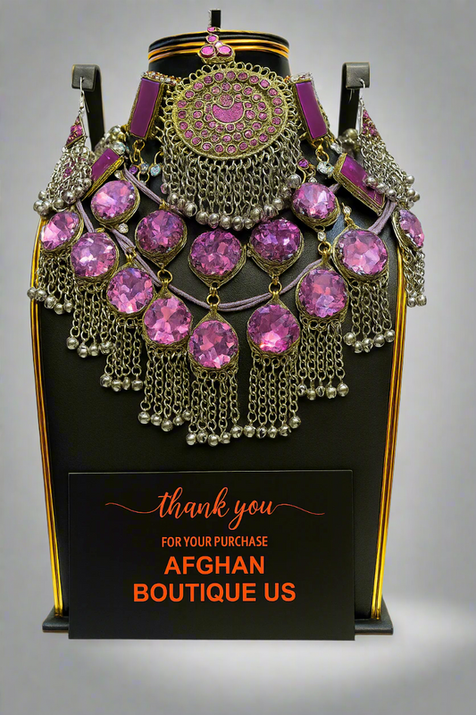 Traditional Afghan bridal jewelry set in silver and pink.